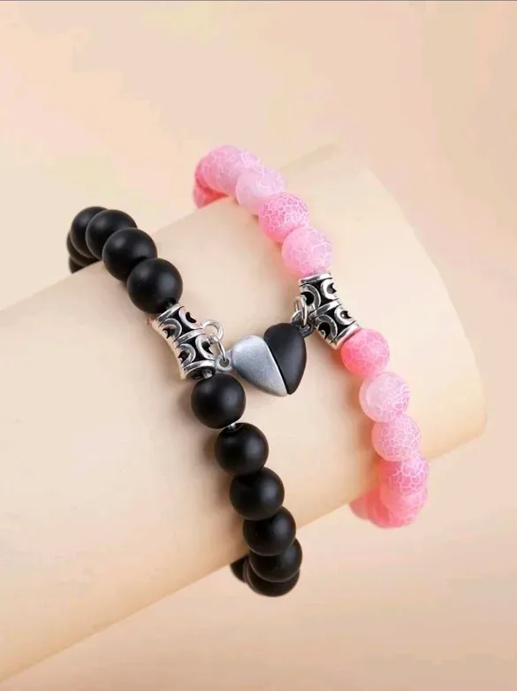 Set de pulseras para dama color rosado con negro.