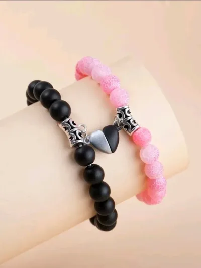 Set de pulseras para dama color rosado con negro.