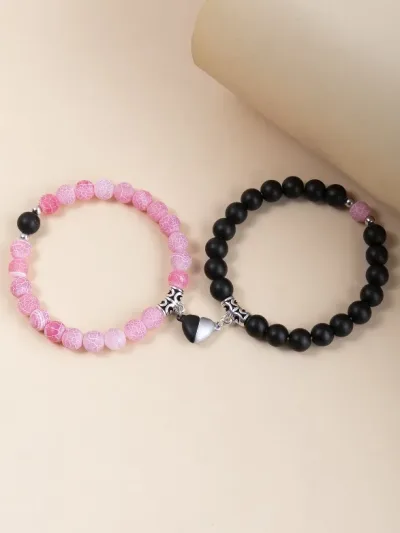 Set de pulseras para dama color rosado con negro.