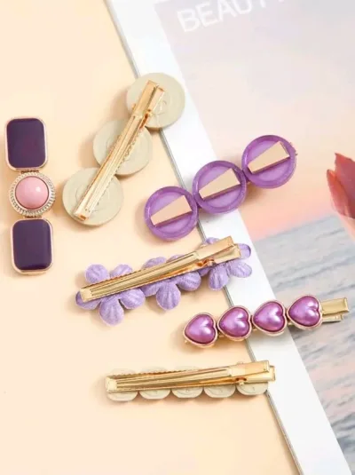 Set de prensas de cabello para dama diseño varios color morado y dorado
