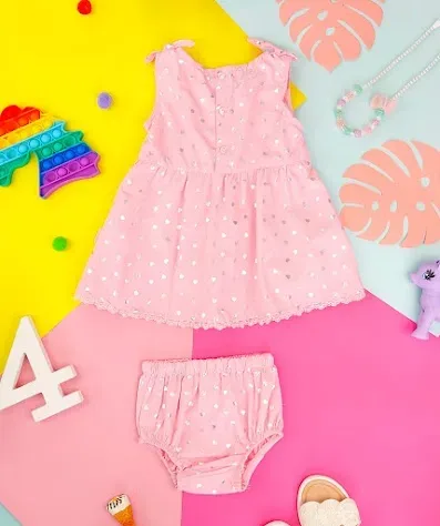 Vestido para niña color rosa con estampado de corazones plateados