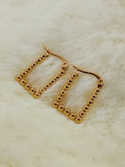 Argollas para dama de acero inoxidable con diseño de bolitas