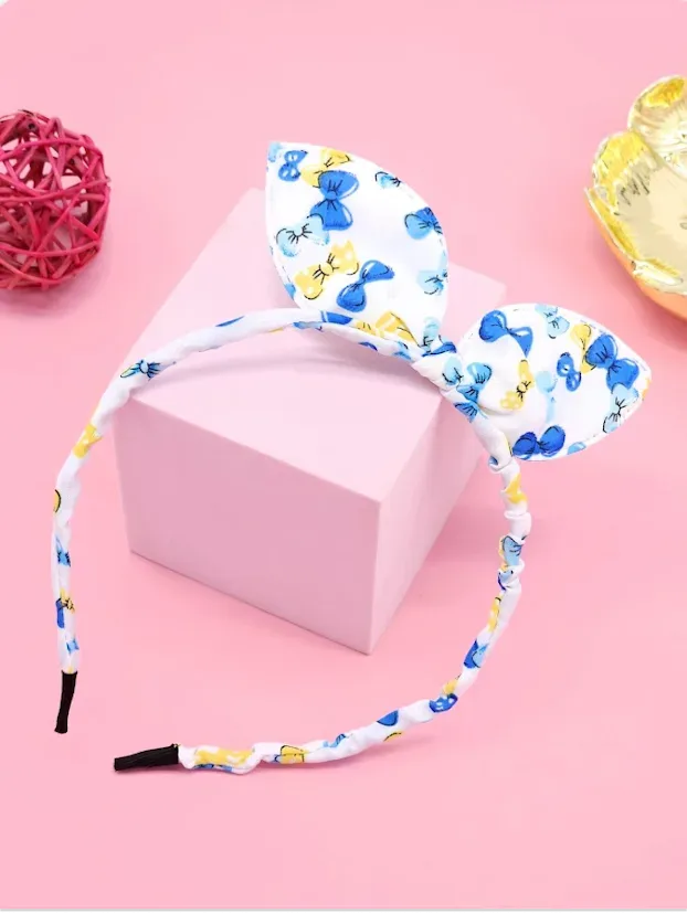 Diadema con diseño lazos con perlas