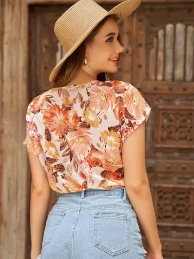 Blusa para dama color naranja con estampado floral