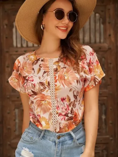 Blusa para dama color naranja con estampado floral