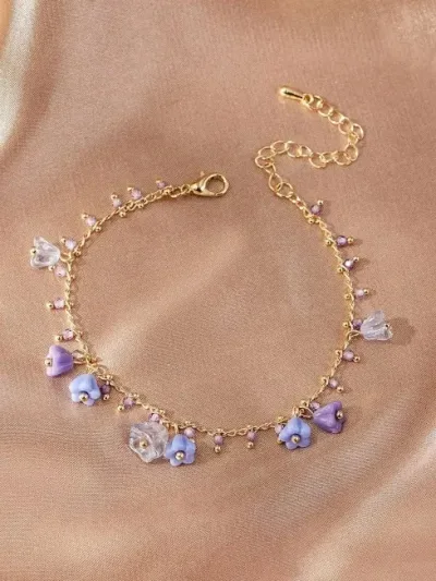 Pulsera de cobre para dama con diseño de flores en color morado