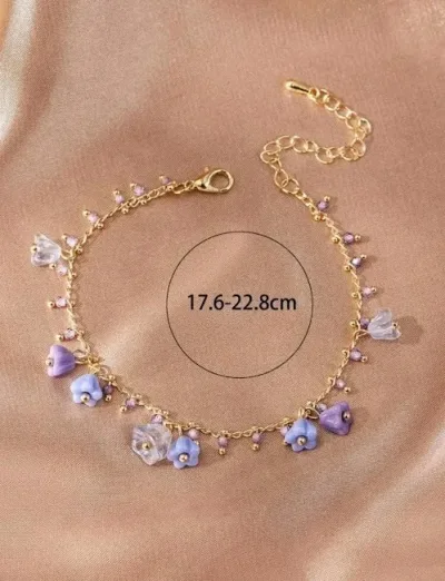 Pulsera de cobre para dama con diseño de flores en color morado