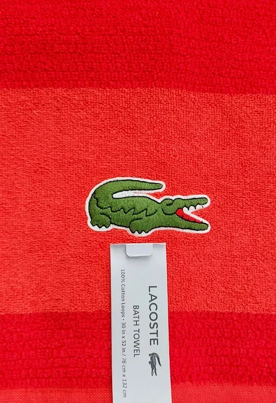 Paño Lacoste 100% algodón, diseño a rayas color blanco y diseños en menta