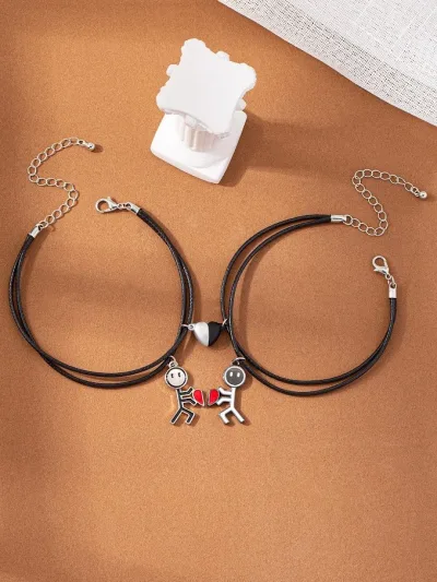 Set de pulseras de dama color negro con accesorio de corazon
