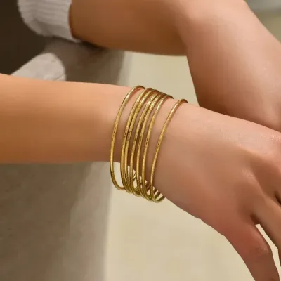 Set de 7 Pulseras de acero inoxidable color dorado