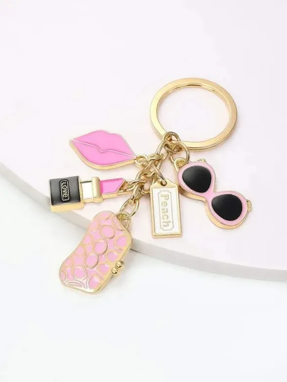 LLavero diseño de labios, lentes, cartera y labial