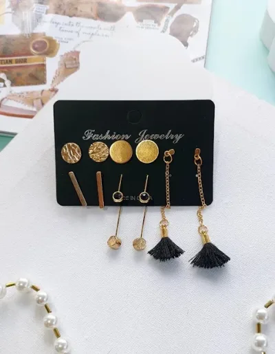 Set de aretes de fantasía para dama color dorado y negro