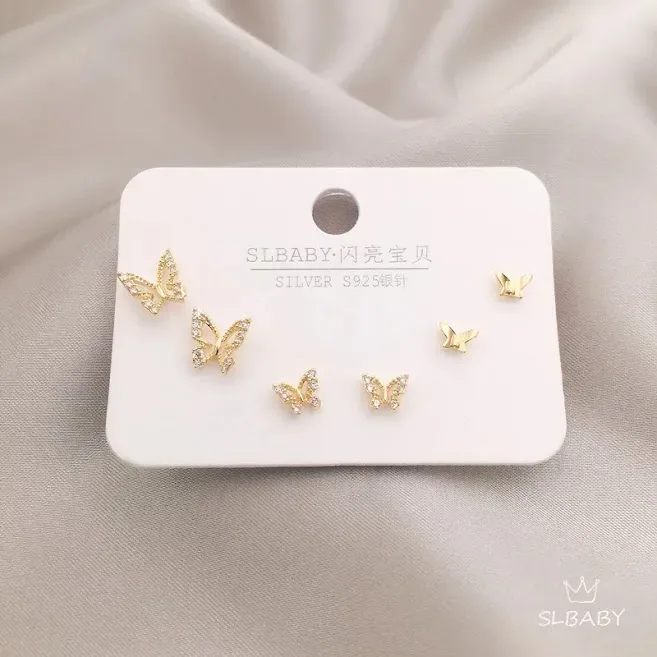 Set de aretes plata 925 con baño de oro diseño de mariposas