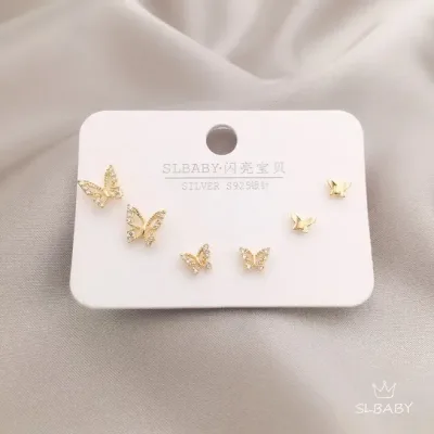 Set de aretes plata 925 con baño de oro diseño de mariposas
