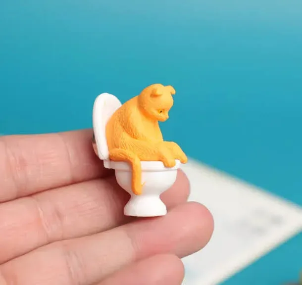 Una decoración magnética con diseño de gato