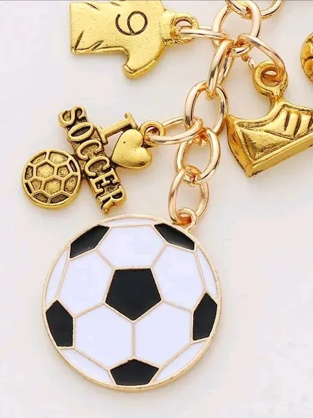 Lavero diseño de futbol color dorado, blanco y negro
