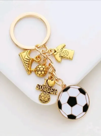 Lavero diseño de futbol color dorado, blanco y negro