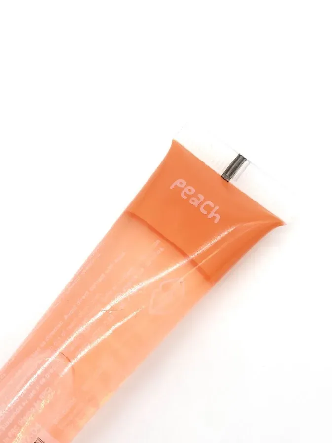 Brillo de labios color naranja