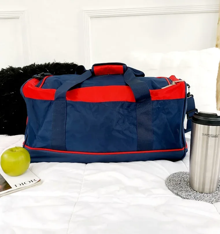 Bolso Nautica unisex color azul y rojo