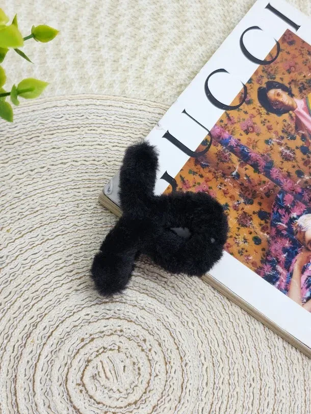 Prensa de peluche negra