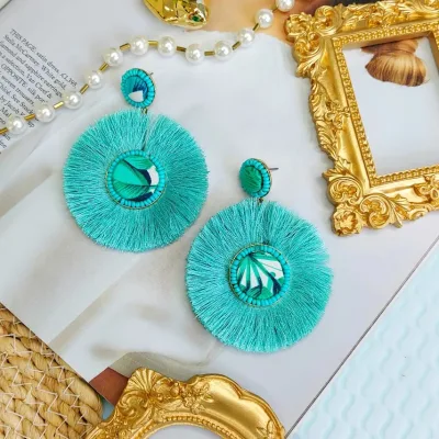 Aretes para dama de fantasía con forma circular color turqueza