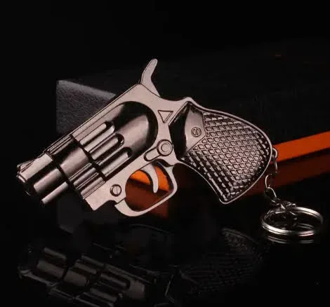 Encendedor con pistola y accesorio para poner en llaves