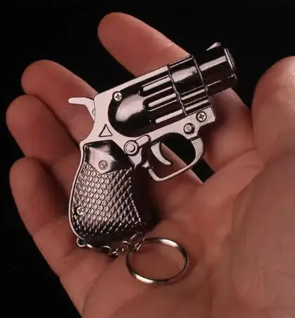 Encendedor con pistola y accesorio para poner en llaves