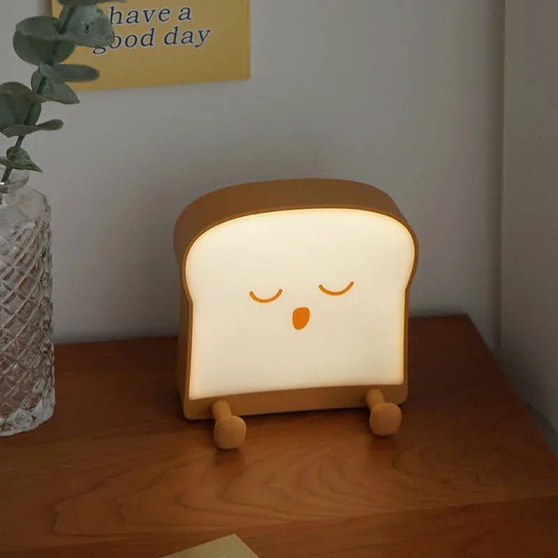 Lámpara de noche de porcelana en forma de tostada con carita dormida
