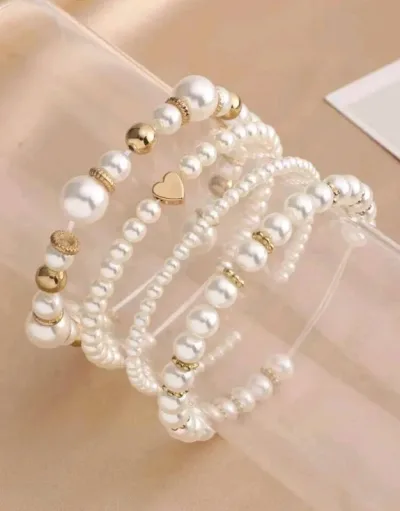 Pulsera con diseño de corazón y perla