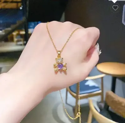 Collar de acero de titanio para dama con dije de oso morado