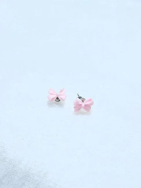 Par de aretes para dama diseño de lazo rosa