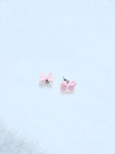 Par de aretes para dama diseño de lazo rosa
