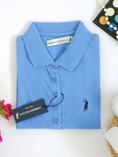 Camiseta Polo Cambrige Club para dama color celeste oscuro