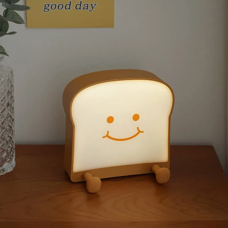 Lámpara de noche de porcelana en forma de tostada con carita feliz
