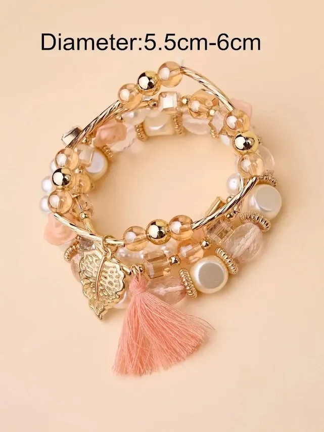 Pulsera para dama color dolorado con perlas y flecos