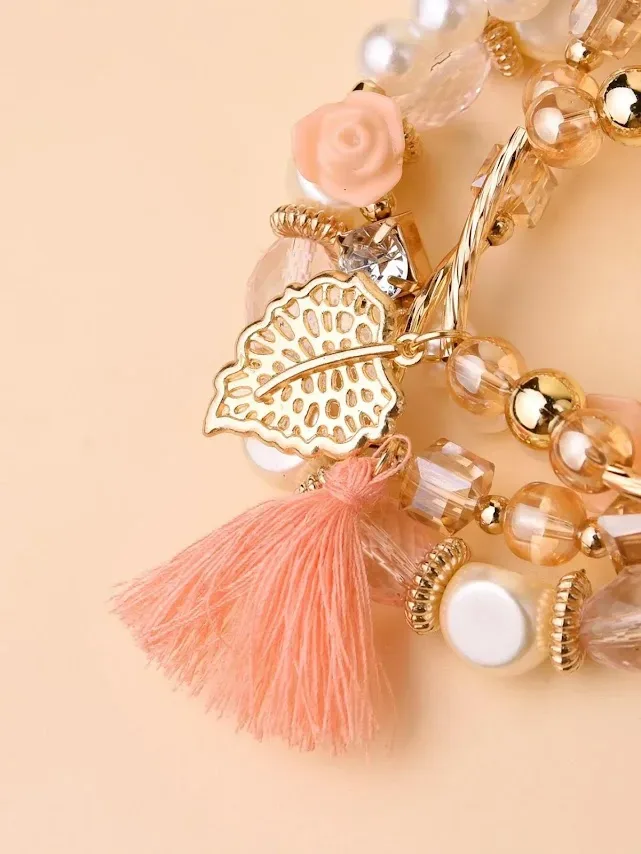 Pulsera para dama color dolorado con perlas y flecos
