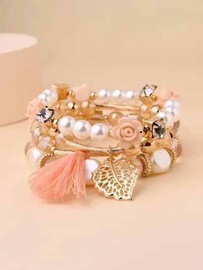Pulsera para dama color dolorado con perlas y flecos