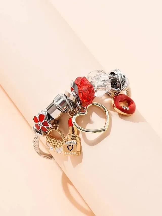 Pulsera de acero inoxidable para dama color plateado con accesorios