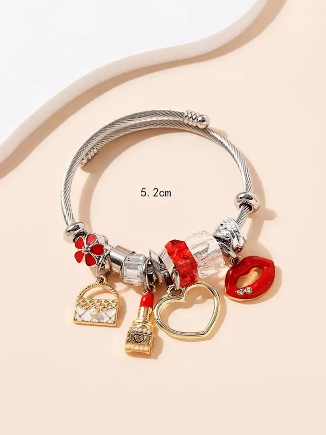 Pulsera de acero inoxidable para dama color plateado con accesorios
