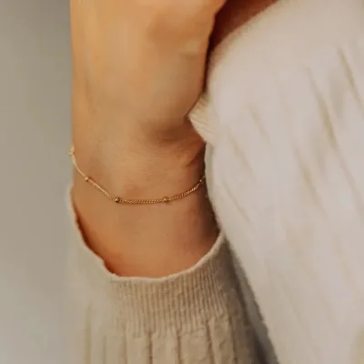 Pulsera para dama de acero inoxidable con baño de oro