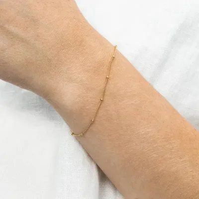Pulsera para dama de acero inoxidable con baño de oro