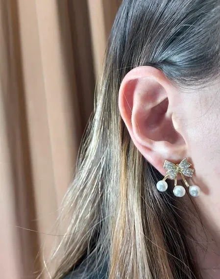 Aretes para dama con diseño de lazo