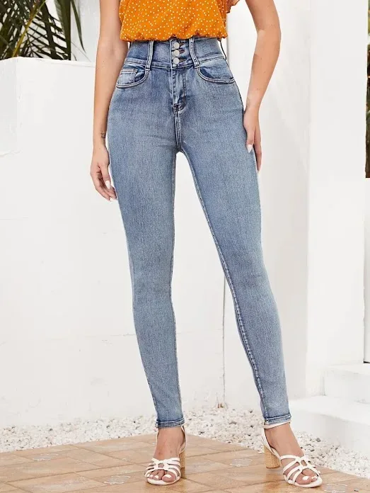 Jeans ajustados de talle alto con cremallera
