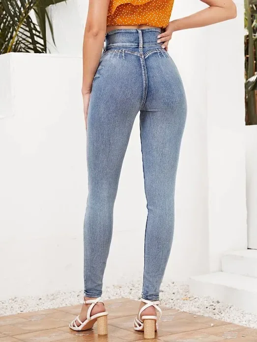 Jeans ajustados de talle alto con cremallera
