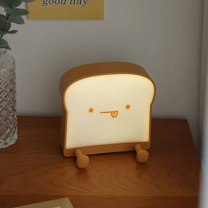 Lámpara de noche de porcelana en forma de tostada con carita de lengua