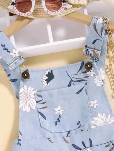 Overol para niña color celeste con estampado floral