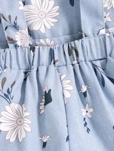Overol para niña color celeste con estampado floral