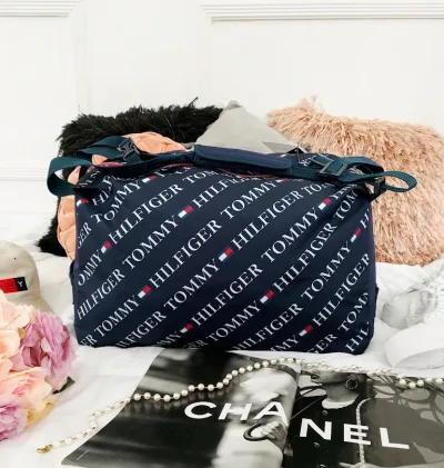 Bolso mochilero Tommy Hilfiger unisex color azul