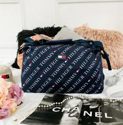 Bolso mochilero Tommy Hilfiger unisex color azul