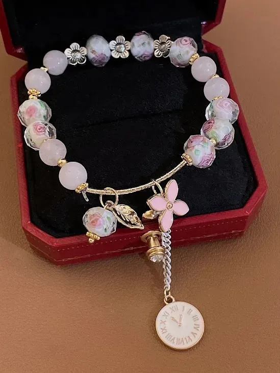 Pulsera para dama de fantasia color rosa con diseño de flor